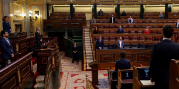 Spanish MPs observe a minute silence in memory of victims of coronavirus outbreak at the opening of the plenary session at Lower Chamber of Spanish Parliament, in Madrid, Spain, 09 April 2020. The session is to be focused in passing a new extension of the state of alarm due to COVID-19 outbreak. EFE/Mariscal POOL