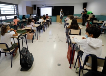 Children attend to the explanations of theachers inside a classroom at Santa Teresa school in Valencia city, eastern Spain, at the first day of the school year, 07 September 2020. Some Spanish regions start the school year on 07 September, while others begin in the upcoming days, but all of the have made changes to fight Coronavirus spread. EFE/Juan Carlos Cardenas POOL