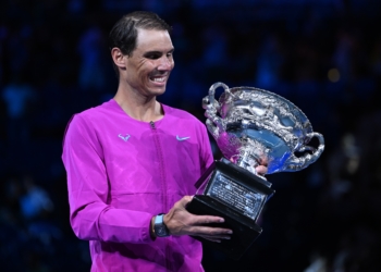 Rafael Nadal of Spain celebrates with the trophy after defeating Daniil Medvedev of Russia in the men'Äôs singles final at the Australian Open grand slam tennis tournament at Melbourne Park in Melbourne, Australia, 30 January 2022. (Tenis, Abierto, Rusia, España) EFE/EPA/DEAN LEWINS AUSTRALIA AND NEW ZEALAND OUT