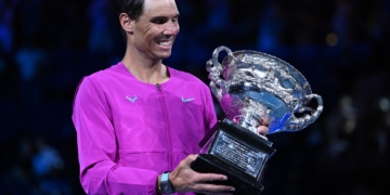 Rafael Nadal of Spain celebrates with the trophy after defeating Daniil Medvedev of Russia in the men'Äôs singles final at the Australian Open grand slam tennis tournament at Melbourne Park in Melbourne, Australia, 30 January 2022. (Tenis, Abierto, Rusia, España) EFE/EPA/DEAN LEWINS AUSTRALIA AND NEW ZEALAND OUT