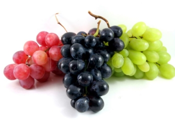 three grapes in different colors isolated on white