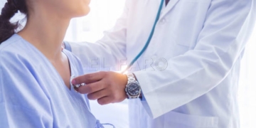 Doctor use stethoscope, checking up heart beat, lunch of auscultation in doctor office at hospital. Patient worker has to get medical checkup every year for her health or medical checkup cardiologist