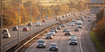 winter sun on sunday motorway traffic Essex England