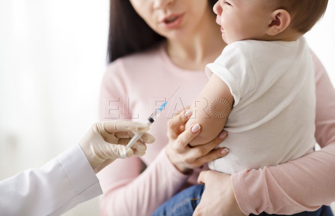Vaccination and immunity strengthening. Doctor giving intramuscular injection to little baby in arm